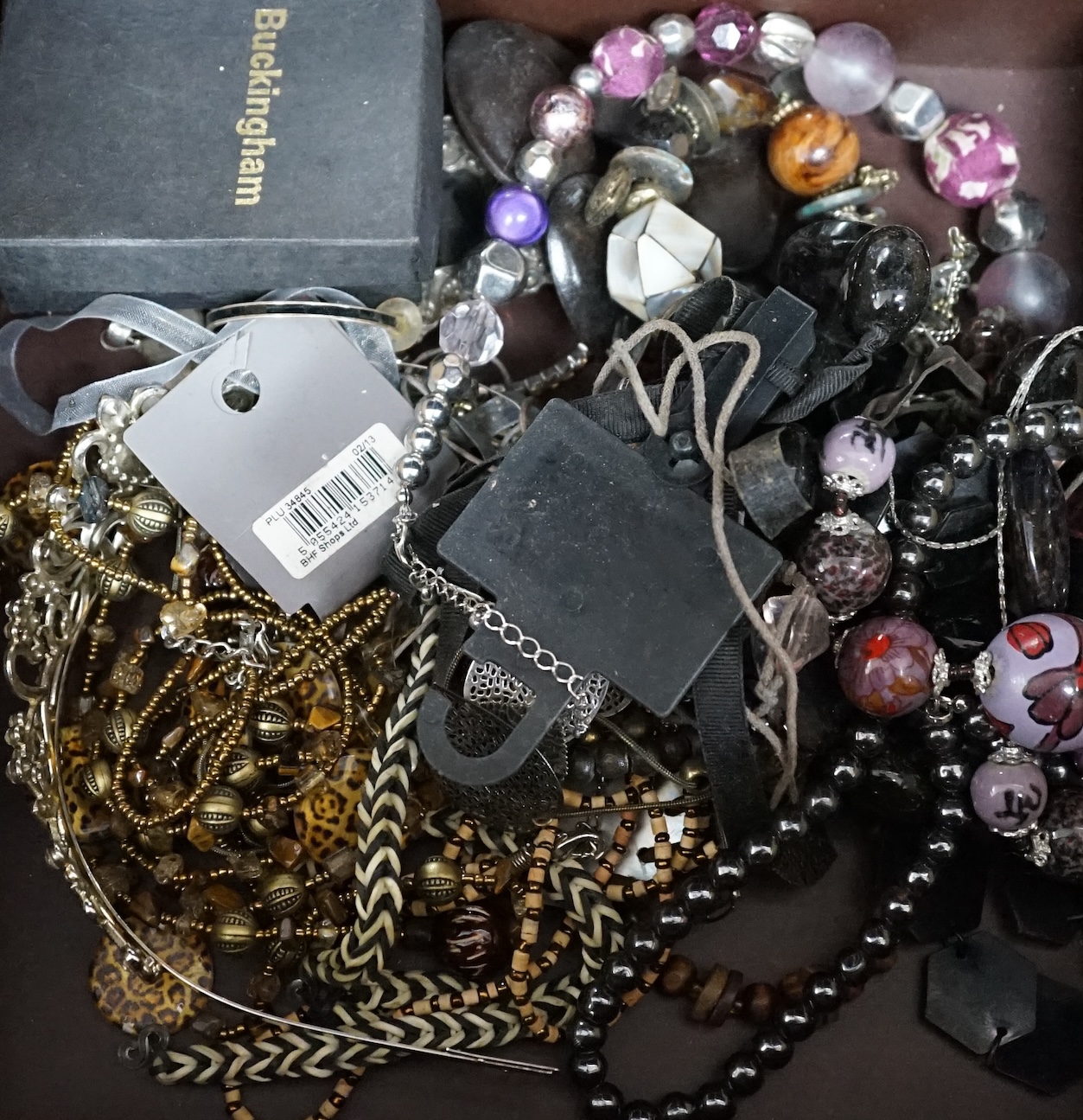 A quantity of assorted costume jewellery. Condition - poor